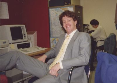 Timothy Theisen In Front Of A Computer As A Young Man