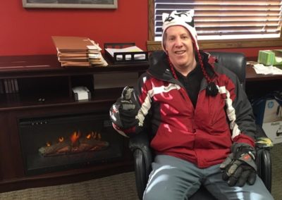 Timothy Theisen In A Winter Hat In His Office